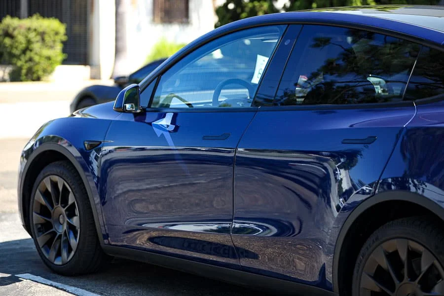 Blue vehicle protected with Eco-Tint paint protection film and ceramic coating