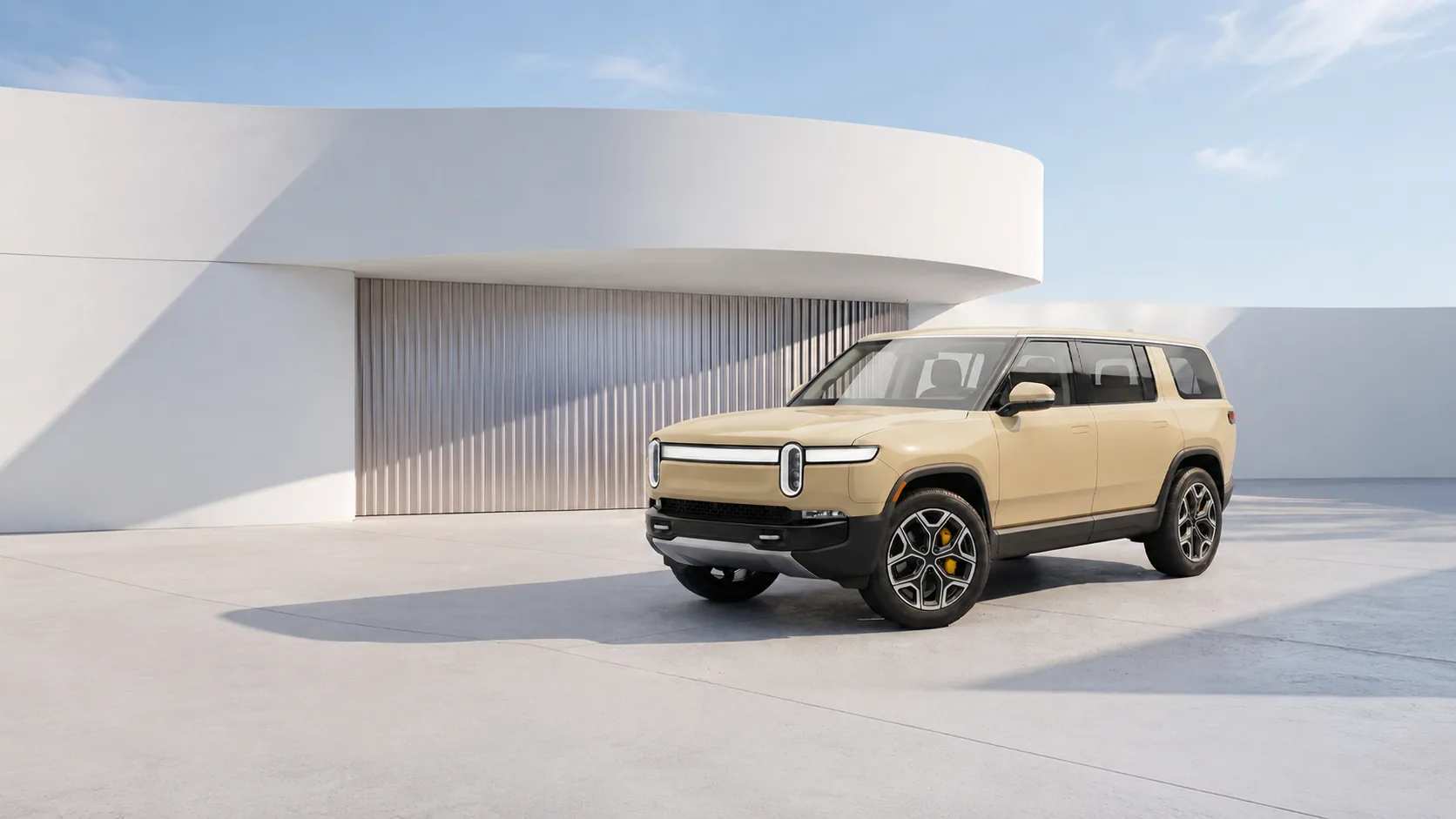 Rivian SUV finished in Avery Dennison Supreme Wrapping Film outside modern architecture