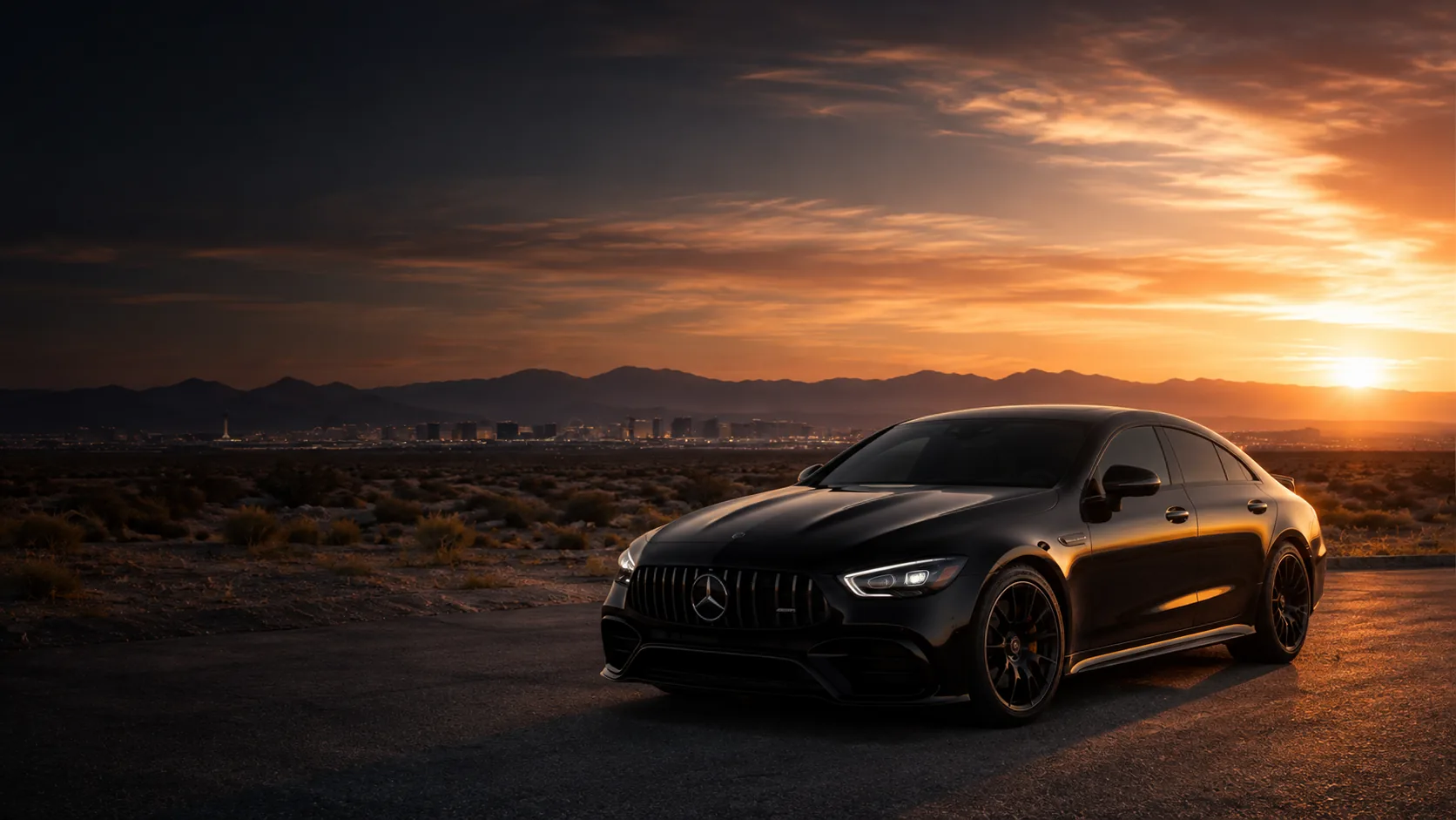 Tinted black Mercedes-Benz at sunset overlooking Las Vegas